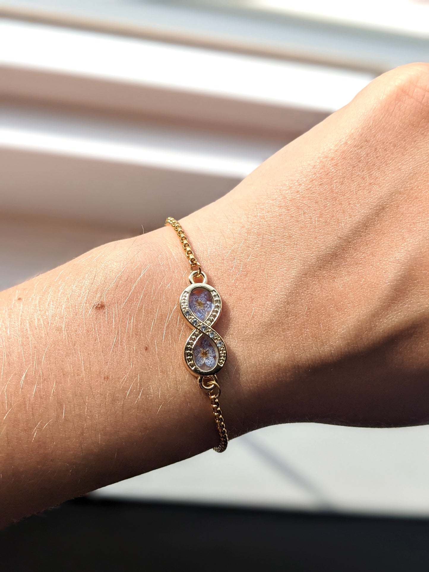 Infinity Bracelet with “Forget-Me-Not” flowers