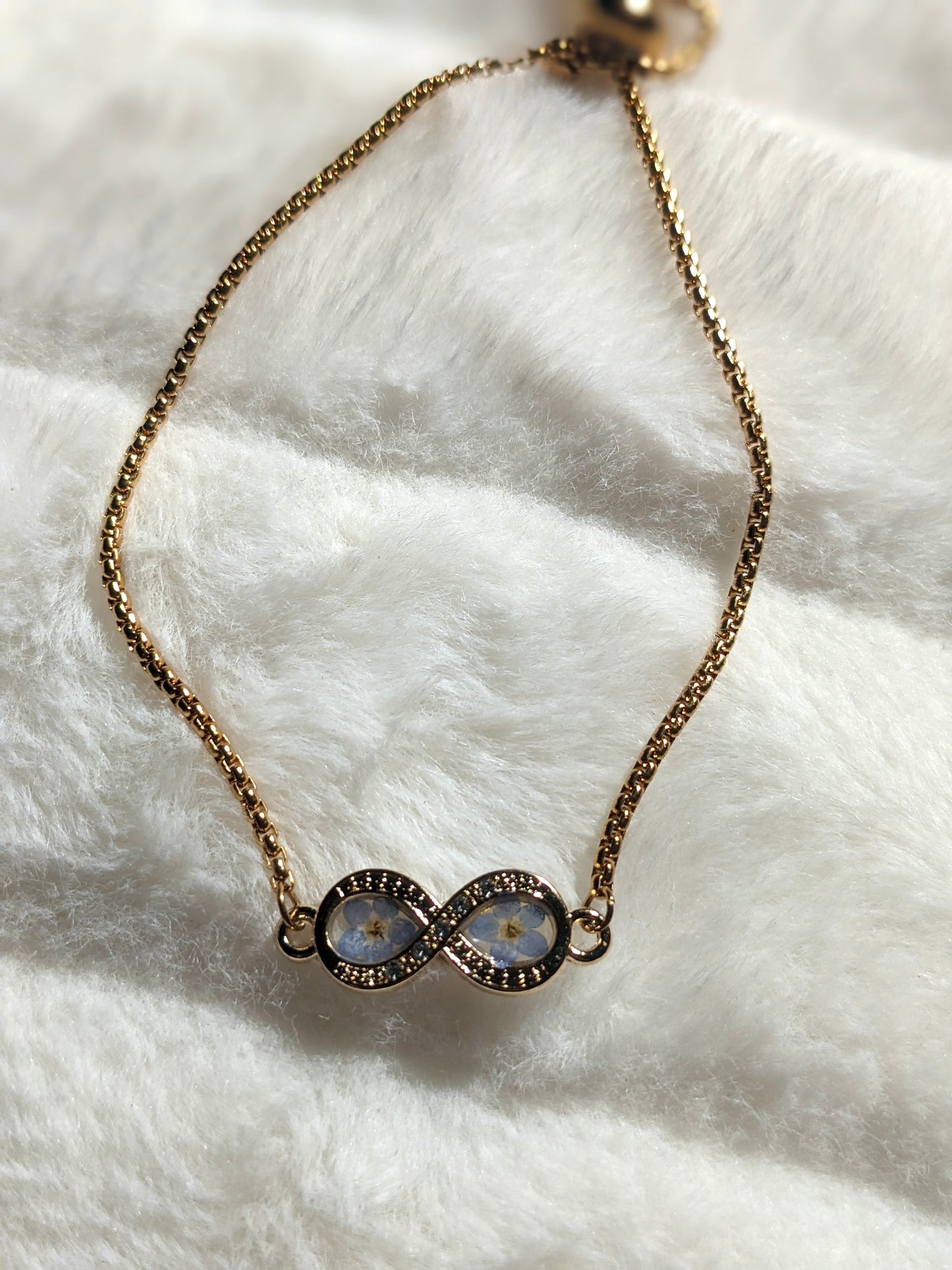 Infinity Bracelet with “Forget-Me-Not” flowers